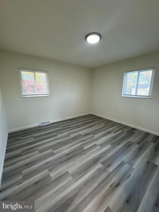 empty room featuring hardwood / wood-style flooring