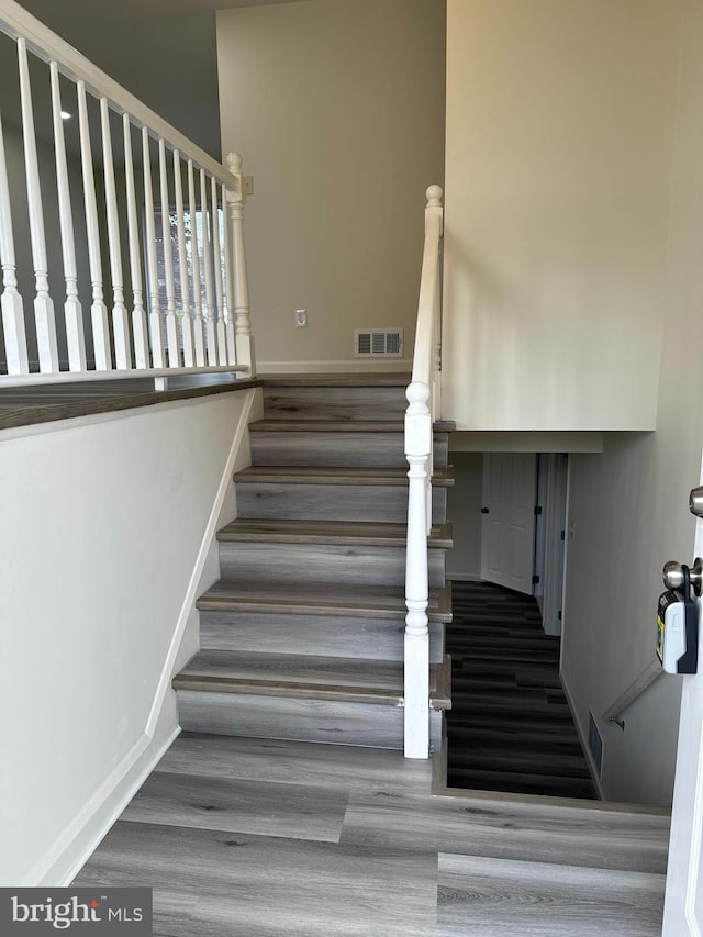 stairway with wood-type flooring