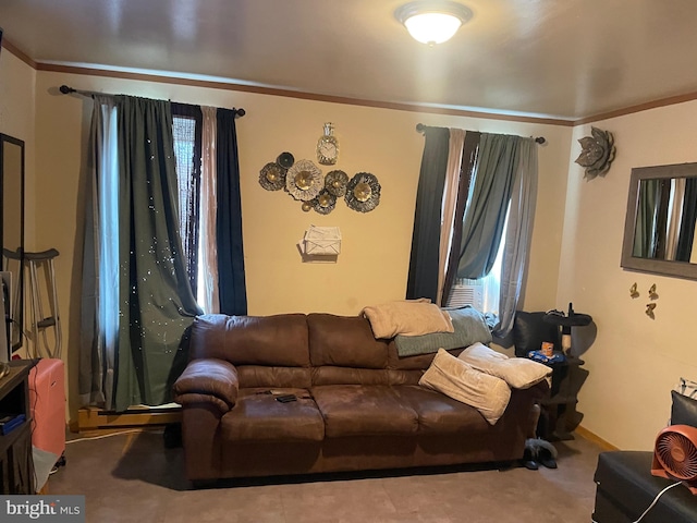 carpeted living room featuring ornamental molding