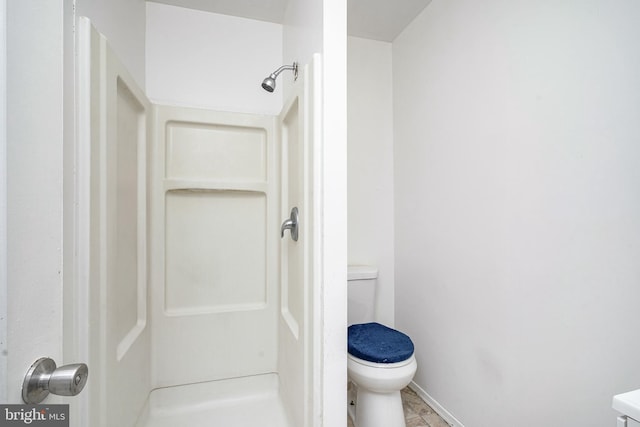 2544 N 25th St, Philadelphia, PA 19132 - bathroom featuring a shower stall, toilet, and baseboards