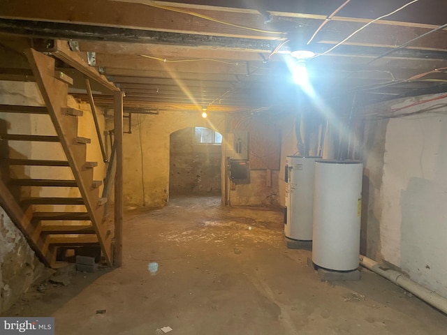 basement featuring gas water heater and water heater