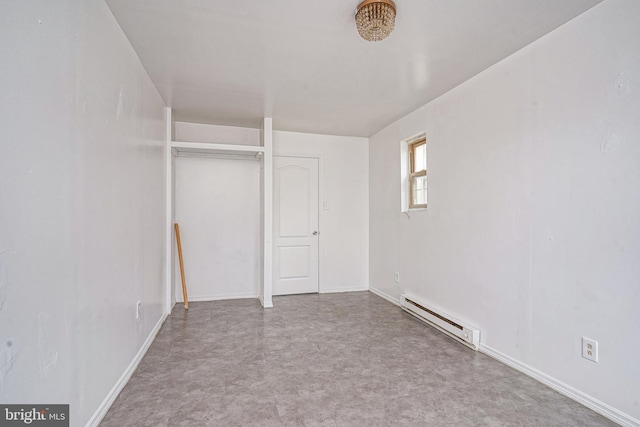 2544 N 25th St, Philadelphia, PA 19132 - unfurnished bedroom with baseboard heating, baseboards, and a closet
