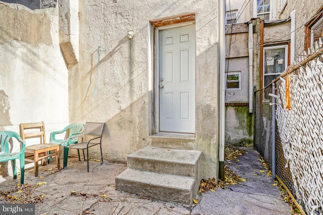 property entrance with a patio area