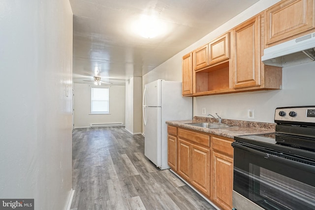 2544 N 25th St, Philadelphia, PA 19132 - kitchen featuring range with electric cooktop, a sink, baseboard heating, under cabinet range hood, and light wood-type flooring