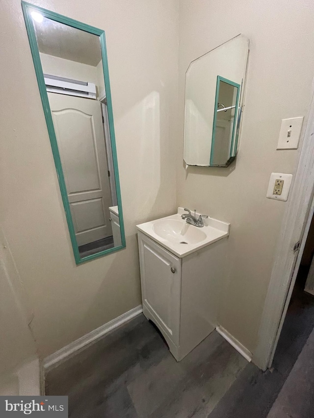 bathroom featuring vanity and hardwood / wood-style flooring