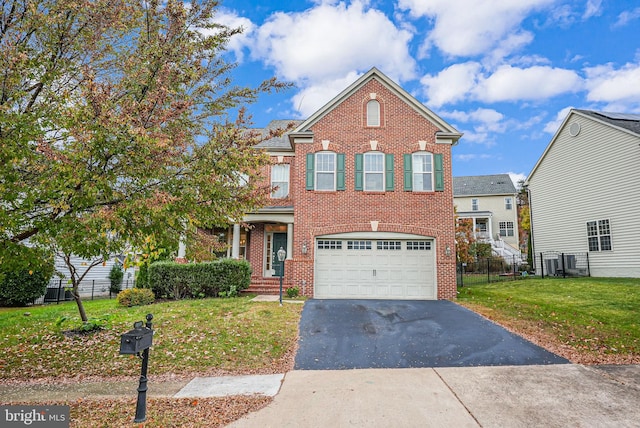 2216 Turnbuckle Ln, Woodbridge, VA 22191 - view of front facade with driveway, brick siding, and a garage
