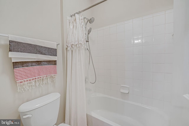 bathroom with shower / bath combination with curtain and toilet