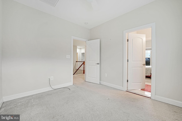 unfurnished bedroom with light colored carpet