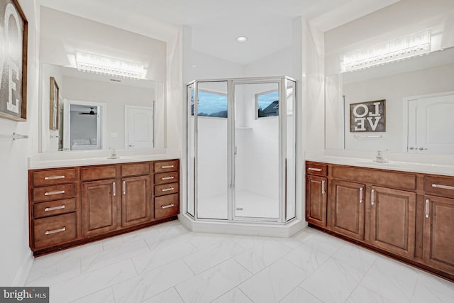 bathroom with vanity, an enclosed shower, and ceiling fan