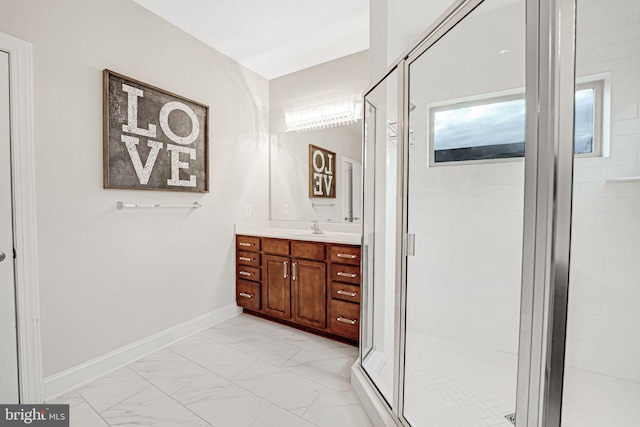 bathroom with vanity and a shower with shower door