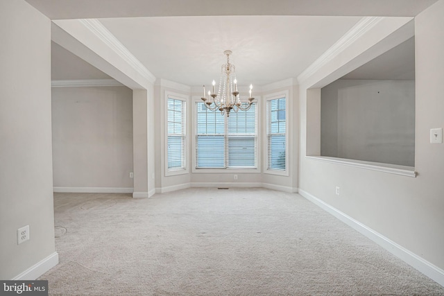 unfurnished dining area with carpet, ornamental molding, and a notable chandelier