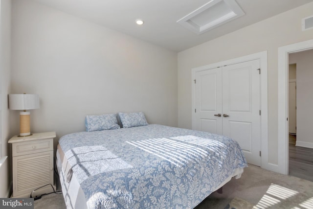 carpeted bedroom with a closet