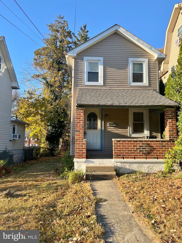 view of front property featuring covered porch