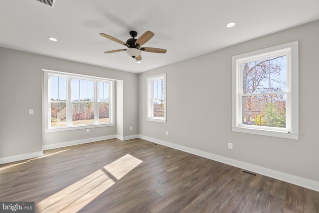 unfurnished room featuring dark hardwood / wood-style floors and ceiling fan