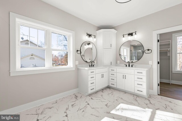 bathroom with a wealth of natural light and vanity