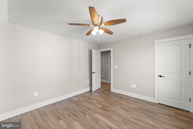 unfurnished bedroom featuring ceiling fan and light hardwood / wood-style floors