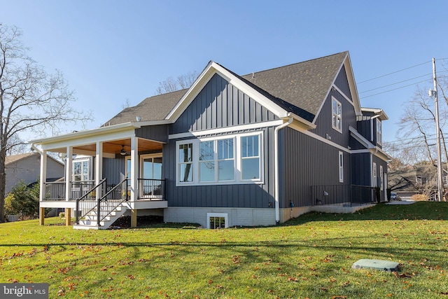 exterior space with a lawn, ceiling fan, and a porch