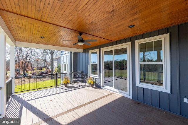 wooden deck with ceiling fan and a porch