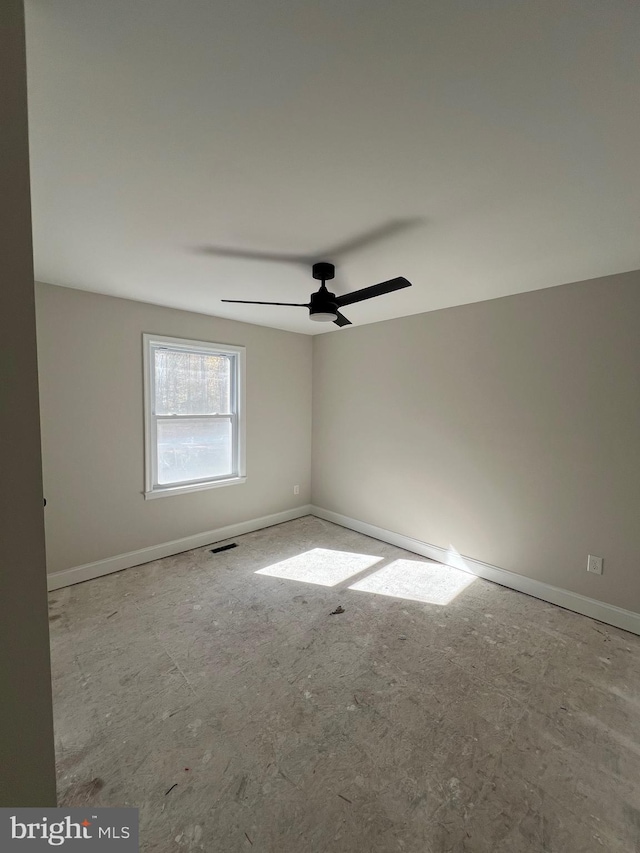 spare room with ceiling fan