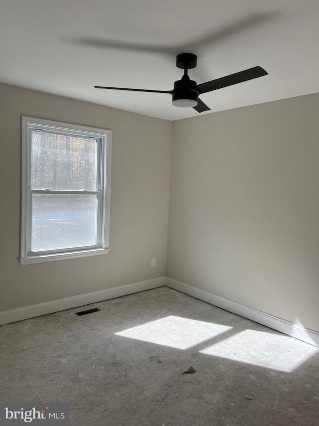 spare room with ceiling fan