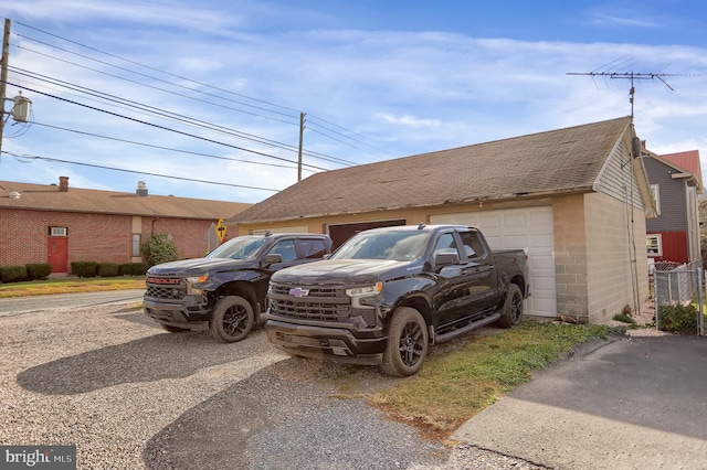 view of car parking with a garage