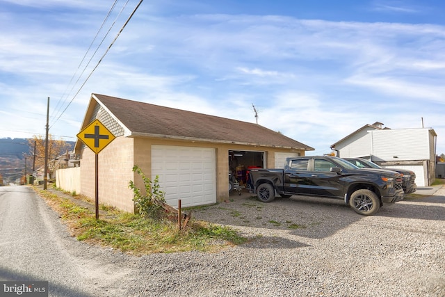 view of side of home featuring a garage