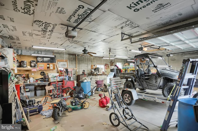 garage featuring a garage door opener and ceiling fan