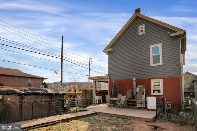 back of property featuring a patio