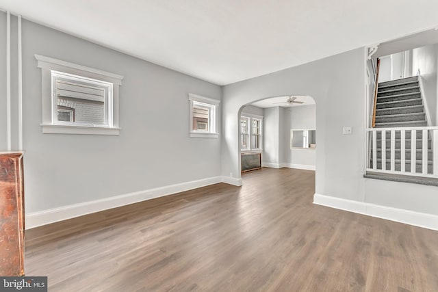 spare room featuring dark hardwood / wood-style flooring and ceiling fan