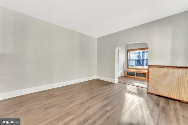 empty room featuring hardwood / wood-style flooring