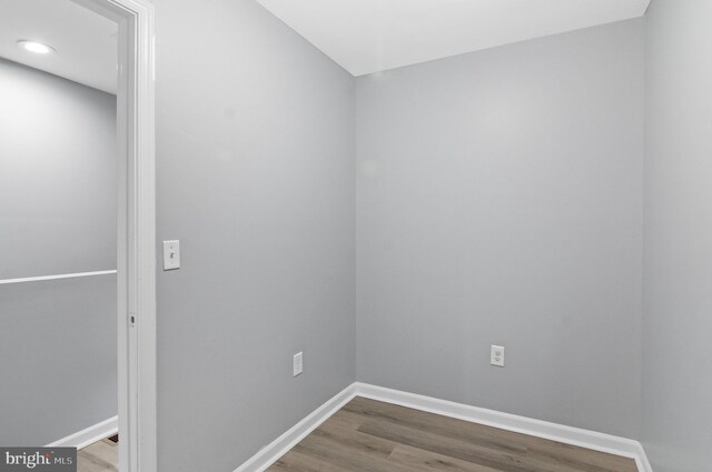 empty room with hardwood / wood-style flooring