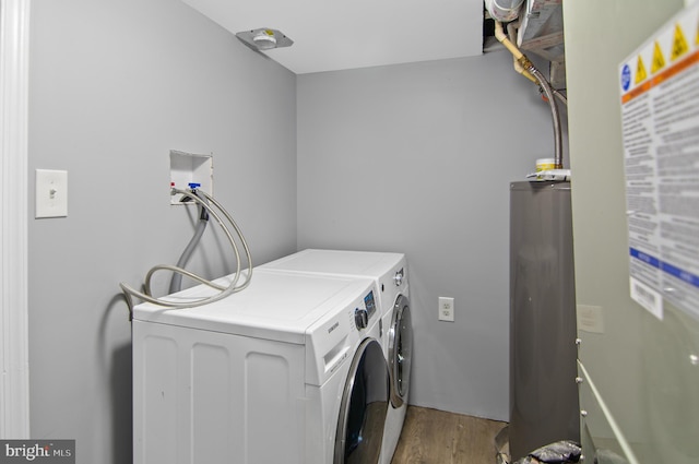 1106 Mckean Ave, Baltimore, MD 21217 - laundry area featuring water heater, separate washer and dryer, and light wood-style flooring
