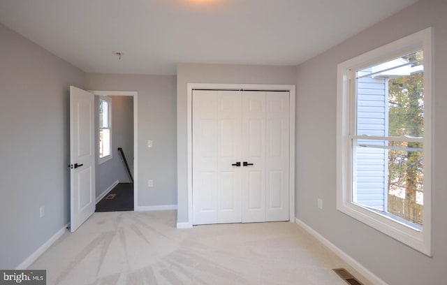 6200 Clay St NE, Washington, DC 20019 - unfurnished bedroom featuring multiple windows, light colored carpet, and baseboards