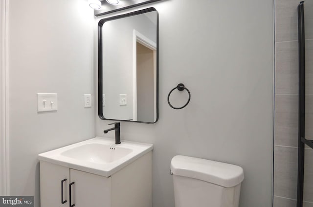 bathroom with toilet and vanity