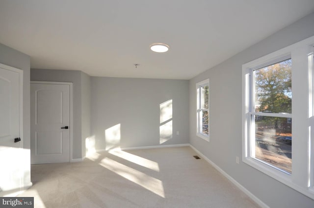 interior space featuring light carpet