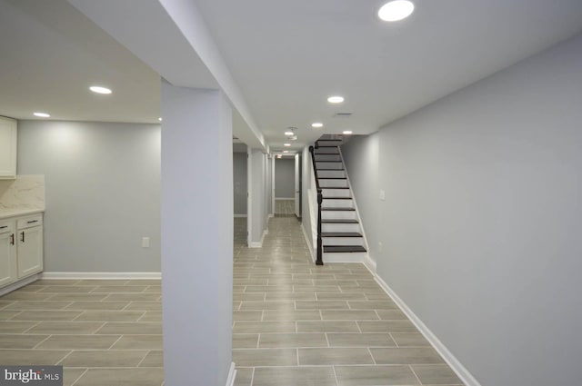 basement with light hardwood / wood-style floors