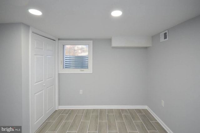 basement featuring light wood-type flooring