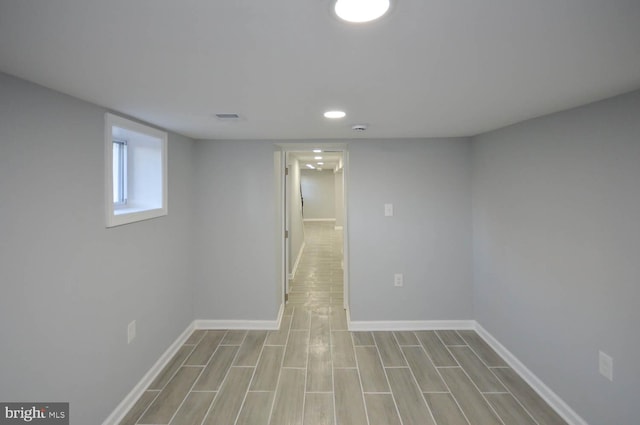 basement featuring light hardwood / wood-style floors