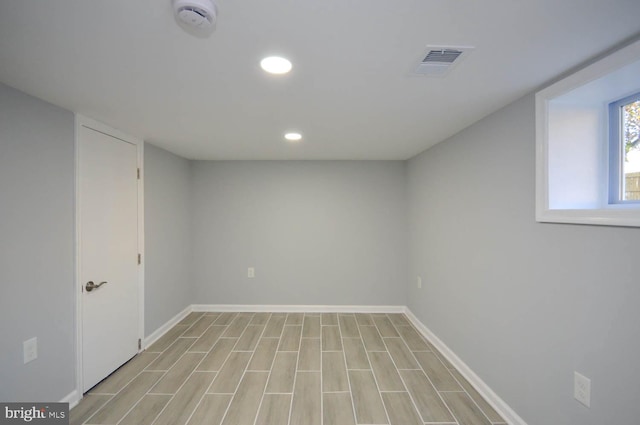 basement featuring light hardwood / wood-style flooring