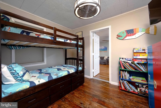 bedroom featuring dark hardwood / wood-style flooring