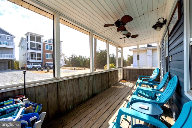 sunroom / solarium featuring wooden ceiling and ceiling fan