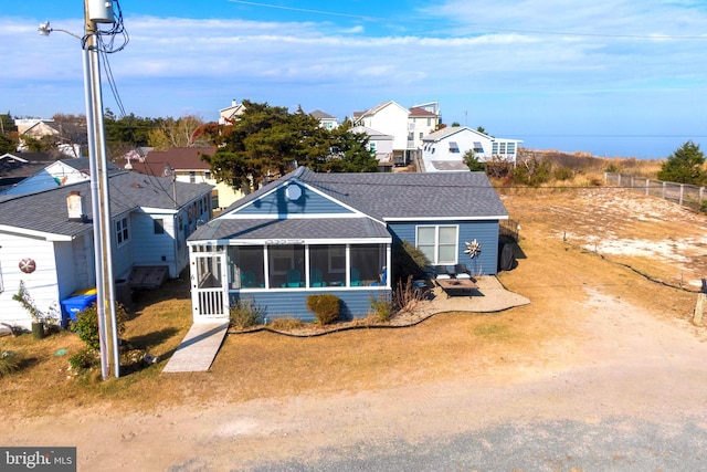 view of front of house featuring a sunroom