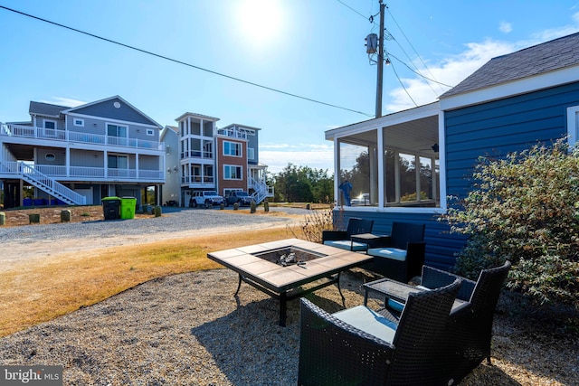 view of yard featuring a fire pit and a patio