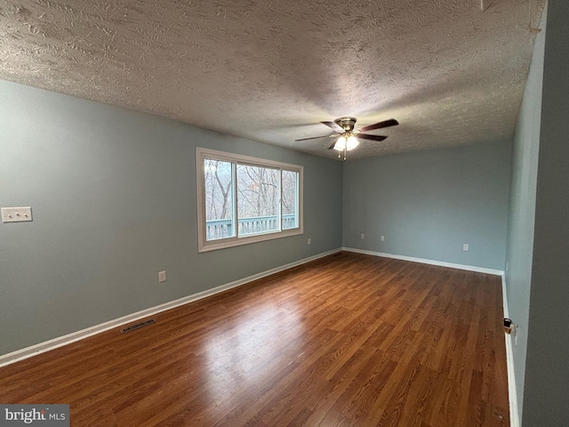 spare room featuring hardwood / wood-style floors, a textured ceiling, and ceiling fan