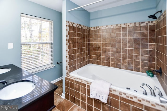 bathroom featuring vanity, tiled shower / bath combo, and tile patterned floors