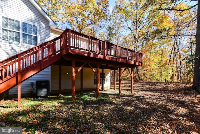 back of house featuring a wooden deck