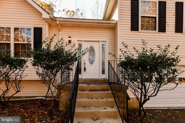 view of exterior entry featuring a garage