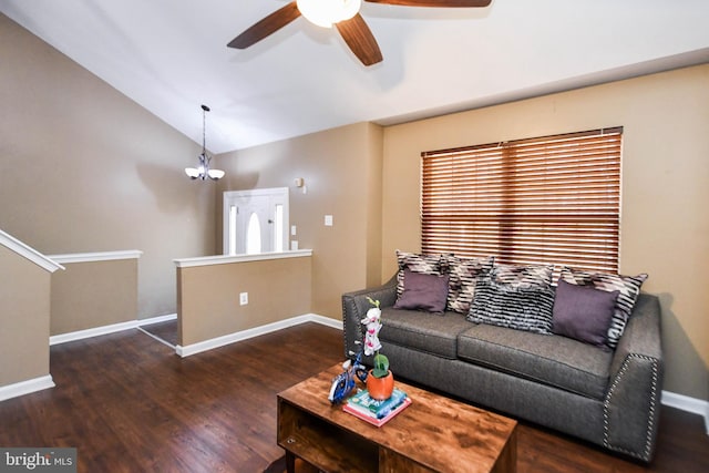 living room with lofted ceiling, dark hardwood / wood-style floors, and ceiling fan with notable chandelier