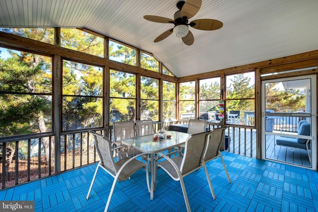 unfurnished sunroom featuring ceiling fan and lofted ceiling