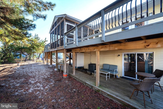 back of house with a deck, central AC unit, and a sunroom